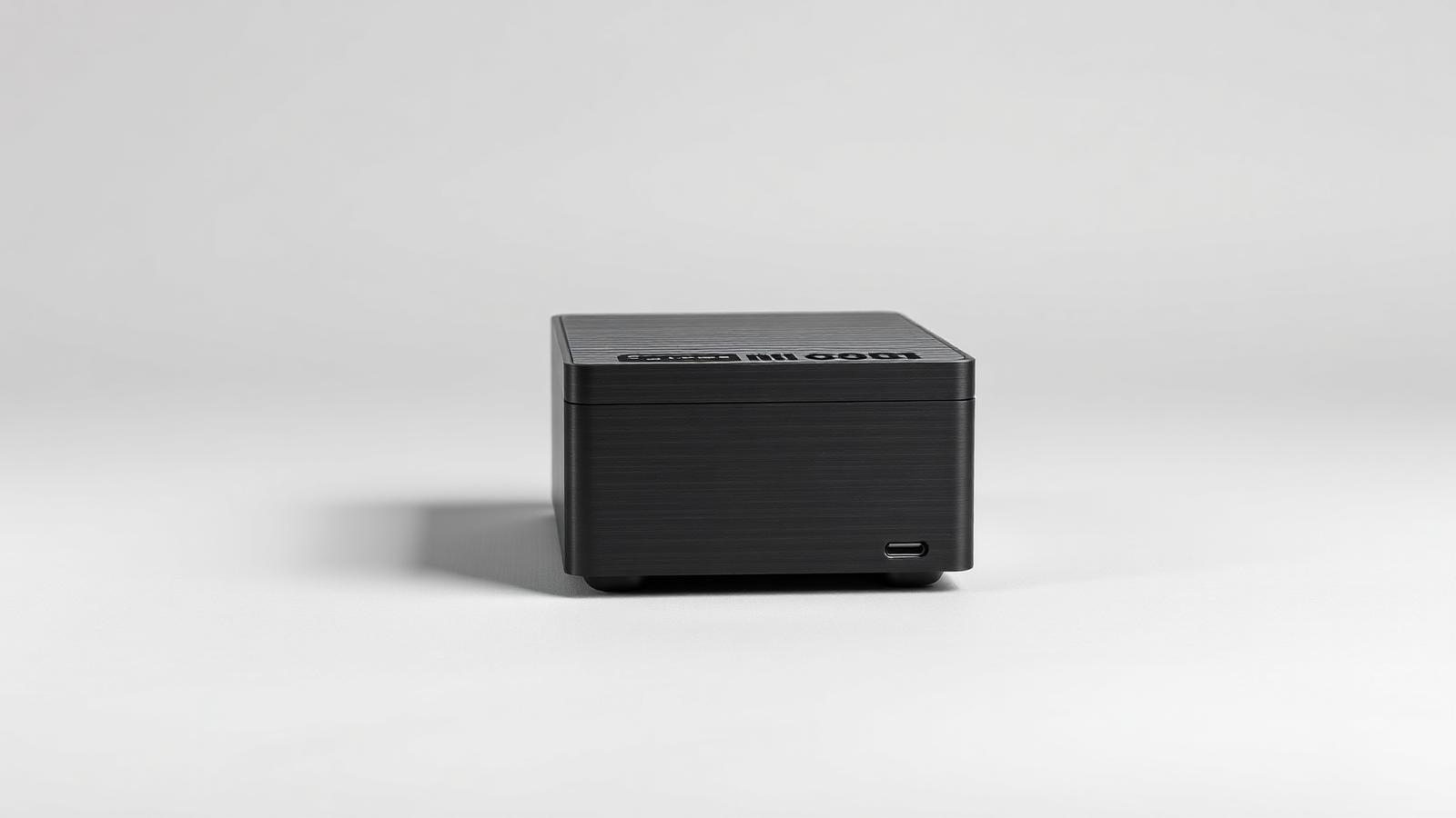 Compact mini PC in a dark aluminium case
